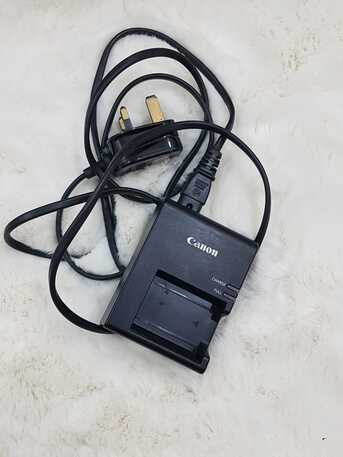 SAR 245,  Original Canon Charger, Lens Cover And Eye Piece photo 3