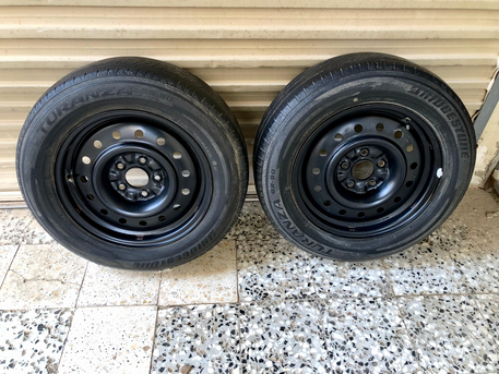 SAR 100,  2 Nissan OEM Steel Rims With Brigistone Tires photo 1