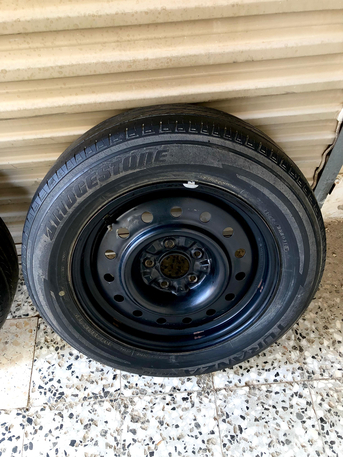 SAR 100,  2 Nissan OEM Steel Rims With Brigistone Tires photo 2