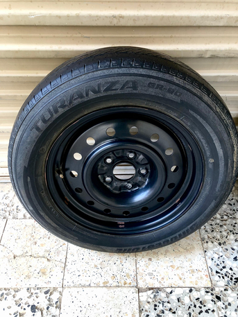 SAR 100,  2 Nissan OEM Steel Rims With Brigistone Tires photo 3
